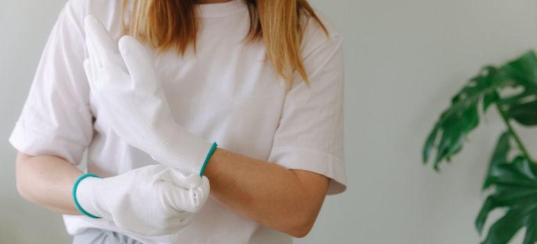 A Woman Wearing White Gloves
