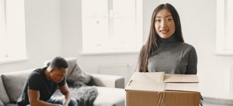 Woman Holding Moving Box