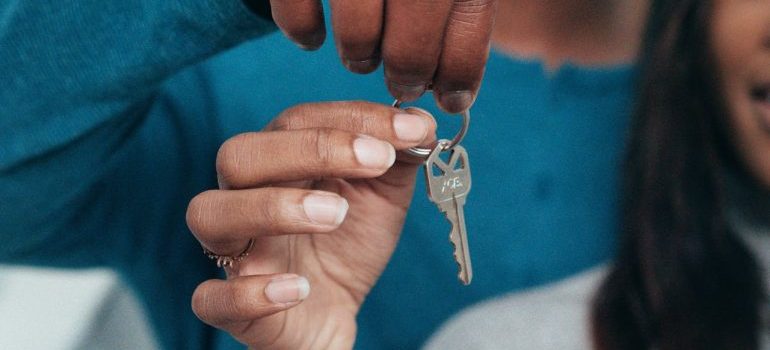 People Holding a Key after relocating with Costa Mesa movers