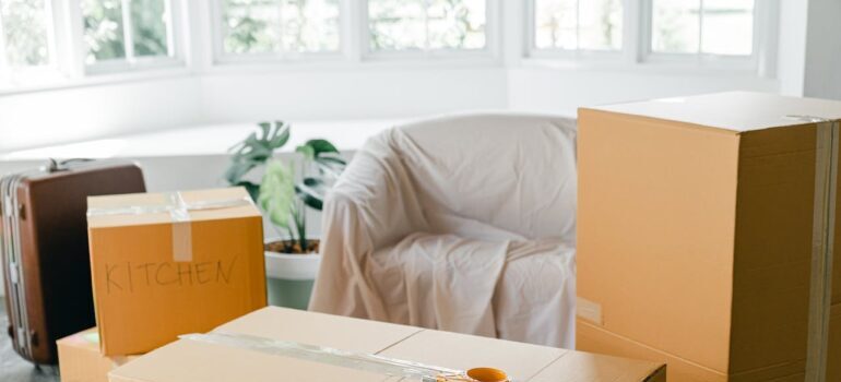Empty apartment with packed carton boxes before moving