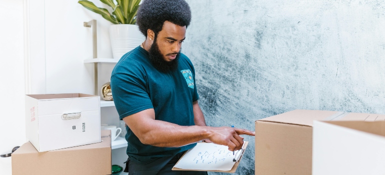 a boy pointing to the box