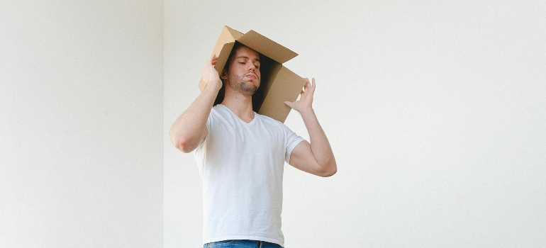A man is having a hard time during relocation, thinking about how to plan a last-minute move in Los Angeles without losing your mind.