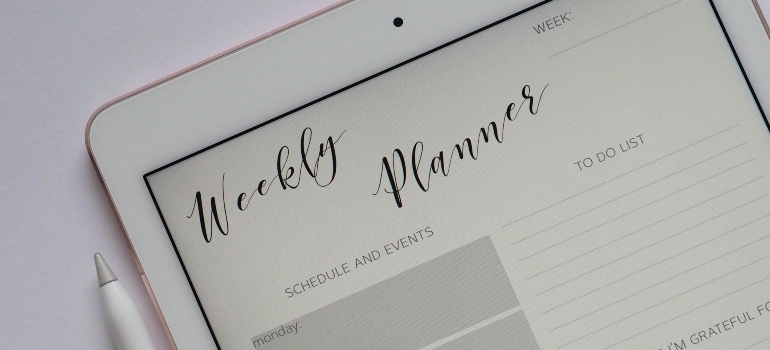 Digital planner open on an iPad used to organize tasks with Woodland Hills movers before the moving day.