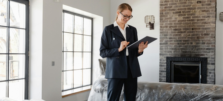 Woman carefully assessing her fragile furniture before the move to ensure proper packing.