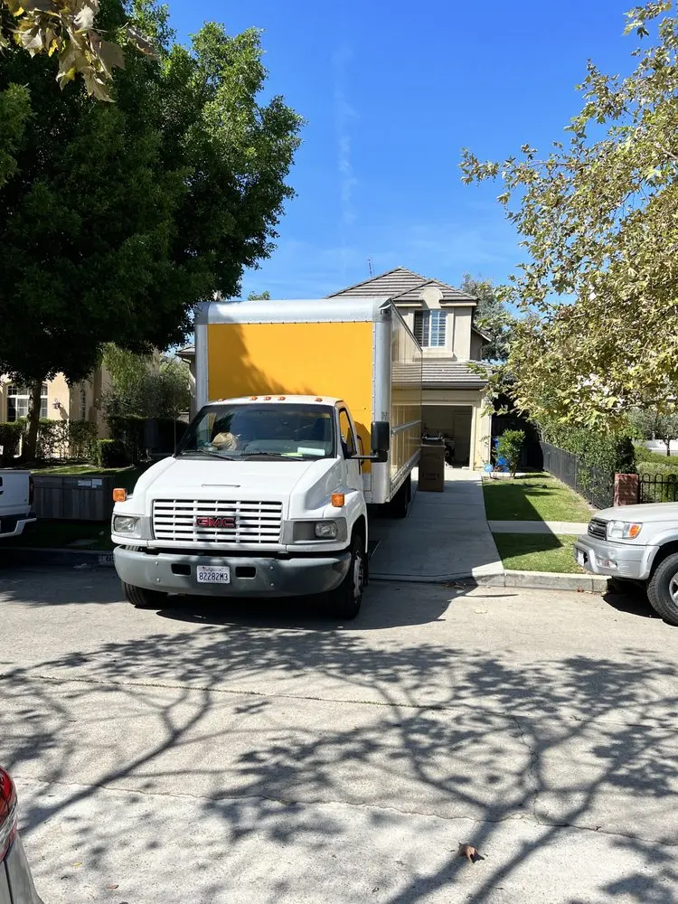 Professional movers packing boxes for a local move