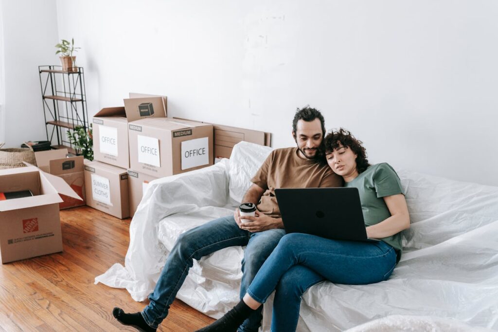 Two people researching movers for their relocation