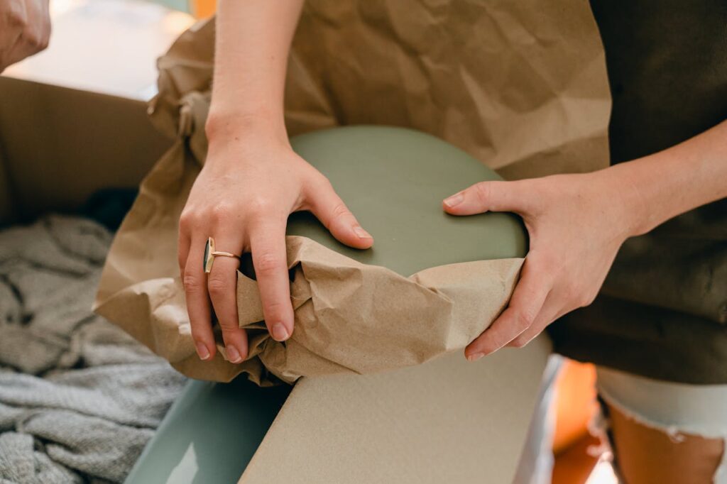 Wrapping fragile decor, focusing on preparing fragile furniture before your movers pick it up.