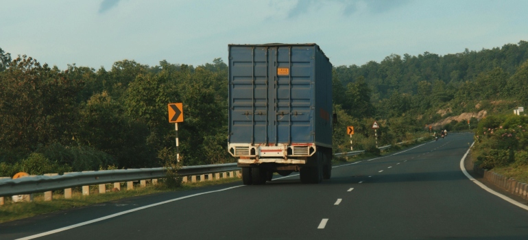 Moving truck driving on highway during a long distance move.