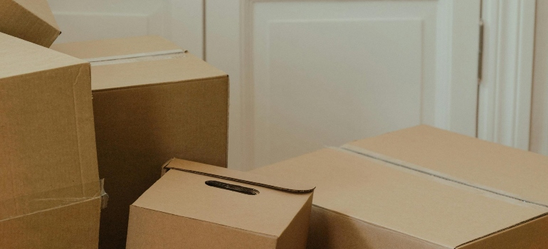 Moving with temporary storage helps declutter a home filled with packed moving boxes