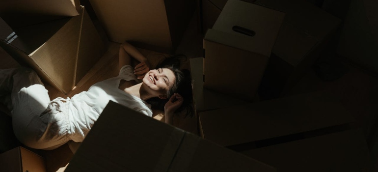 Woman smiling while waiting for an Altadena moving company
