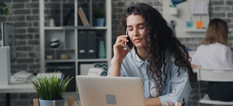 a girl talking on the phone with her chosen Santa Monica movers, Eagle Star Moving